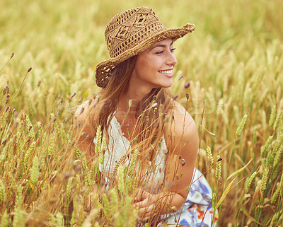 Buy stock photo Happy, woman and thinking in wheat field for peace, growth and environment care in nature. Smile, relax and person in grain farm for agriculture, calm and positive mental health in summer with hat