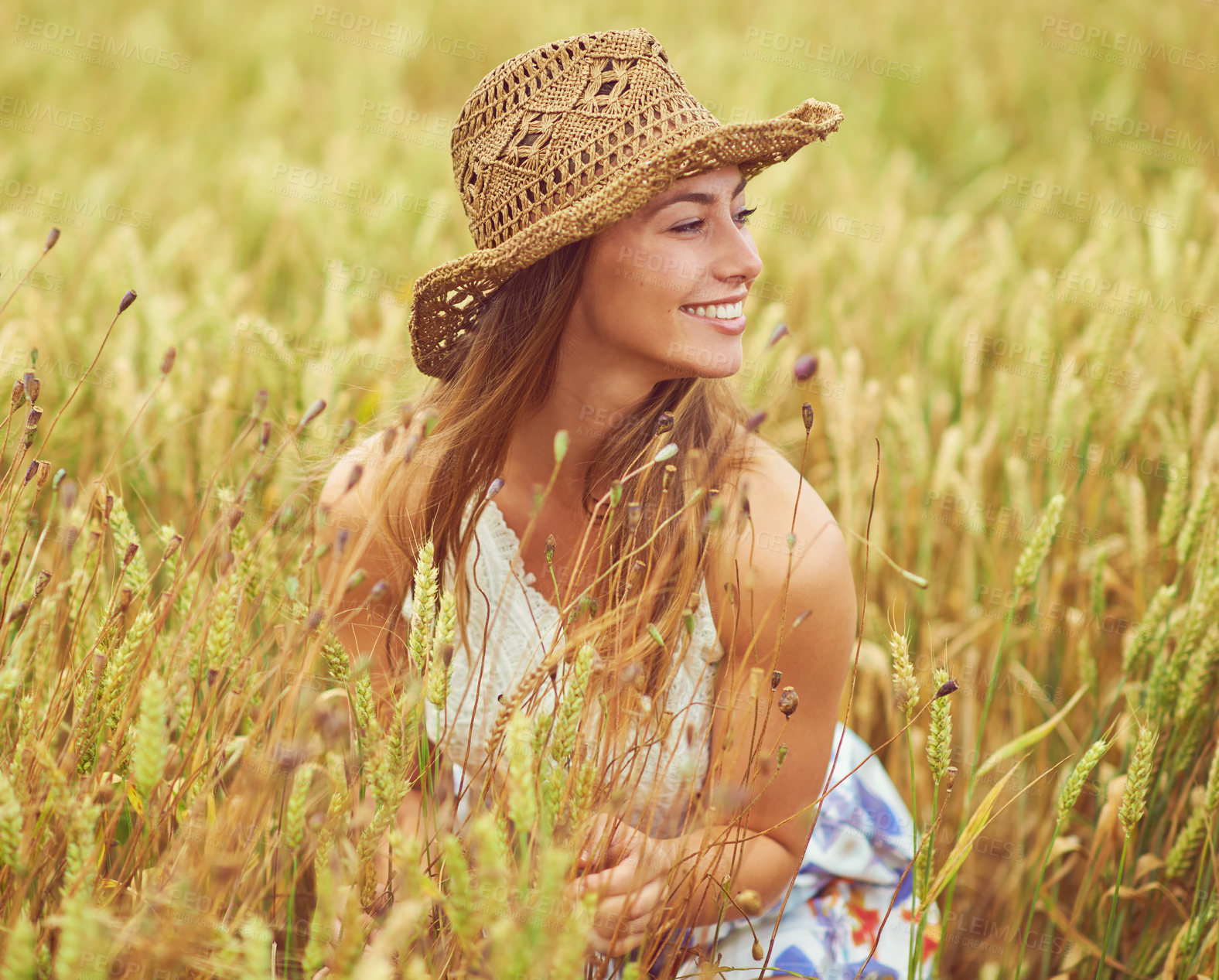 Buy stock photo Happy, woman and thinking in wheat field for peace, growth and environment care in nature. Smile, relax and person in grain farm for agriculture, calm and positive mental health in summer with hat