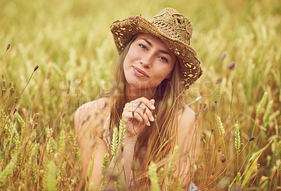 Buy stock photo Portrait, relax and smile with woman in wheat field outdoor for holiday, travel or vacation in summer. Face, hat and wellness with happy person in countryside or nature for calm or peaceful break