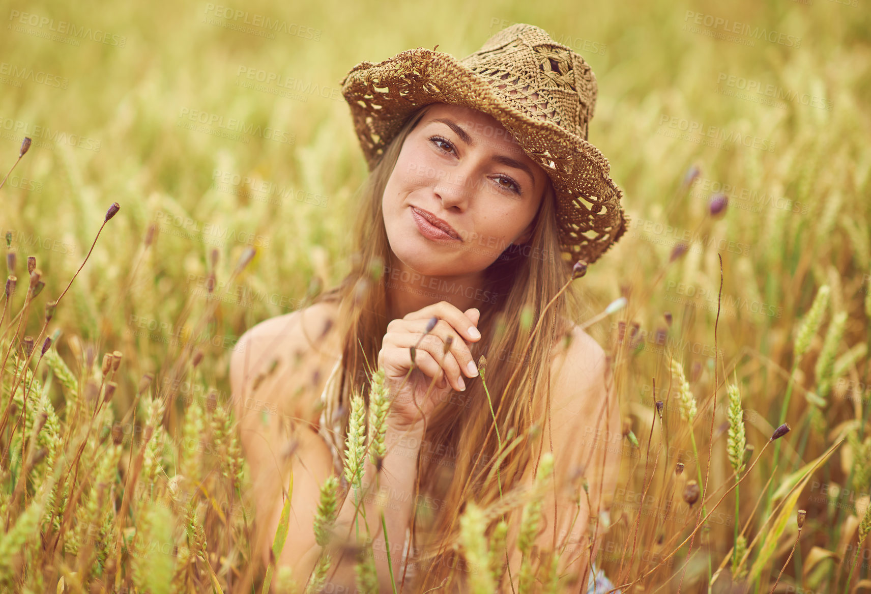 Buy stock photo Portrait, relax and smile with woman in wheat field outdoor for holiday, travel or vacation in summer. Face, hat and wellness with happy person in countryside or nature for calm or peaceful break