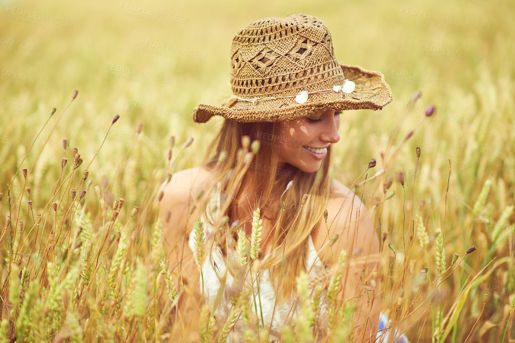 Buy stock photo Happy, woman and thinking in wheat field for relax, growth and environment care in nature. Smile, peace and person in grain farm for agriculture, calm and positive mental health in summer with hat