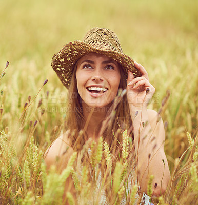 Buy stock photo Smile, woman and thinking in wheat farm for peace, growth and environment care in nature. Happy, relax and person in grain field for agriculture, calm and positive mental health in summer with hat