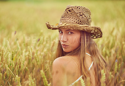 Buy stock photo Portrait, wheat field and woman with nature, wellness and travel with adventure, countryside and summer holiday. Face, person and girl with hat, outdoor and calm with happiness, plants or environment