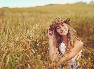 Buy stock photo Cropped shot of a young woman in a wheat field