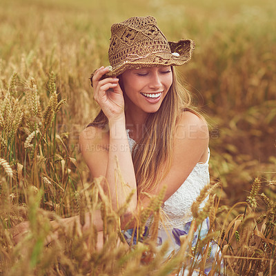 Buy stock photo Ecology, relax and smile with woman in wheat field outdoor for holiday, travel or vacation in summer. Hat, organic and wellness with happy person in countryside or nature for calm or peaceful break