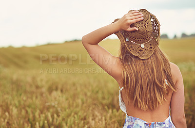 Buy stock photo Back, relax and view with woman in wheat field outdoor for holiday, travel or vacation in summer. Hat, space and wellness with person sightseeing in countryside or nature for calm or peaceful break