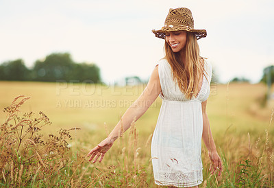 Buy stock photo Cropped shot of a young woman in a wheat field