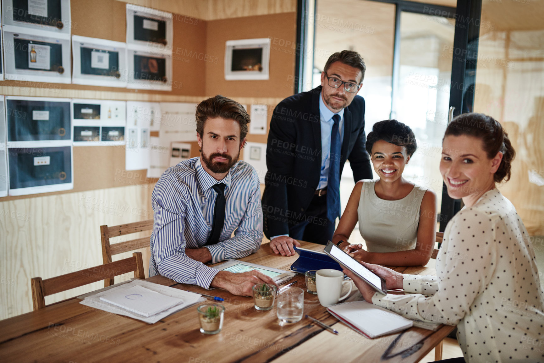 Buy stock photo Portrait of a group of colleagues working together in an office