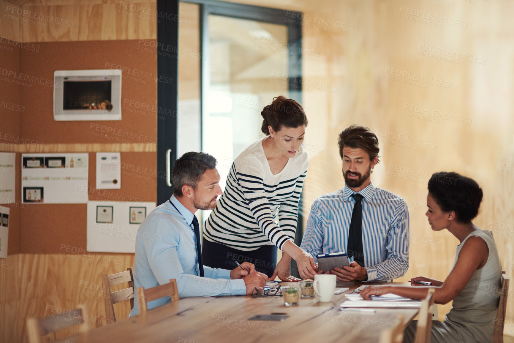 Buy stock photo Shot of a group of colleagues working together in an office