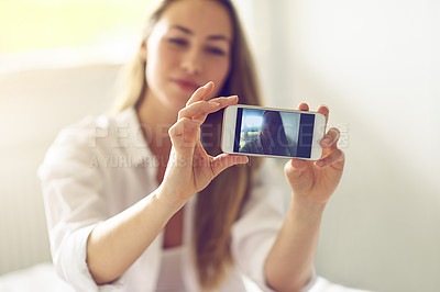 Buy stock photo Selfie, phone screen and girl on bed with smile, relax and social media post on weekend morning. Smartphone, photography and confident woman in hotel bedroom with digital memory for happy travel blog