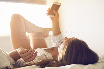 Buy stock photo Shot of an attractive young woman relaxing in her bedroom