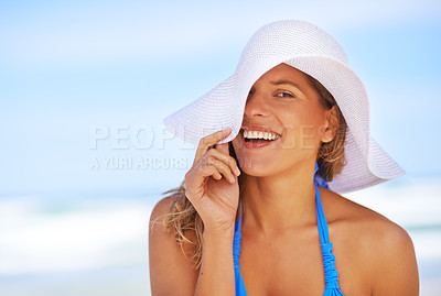 Buy stock photo Woman, ocean and hat in playful portrait, outdoor vacation and trip to Maldives paradise. Female person, half face and waves for peace on weekend travel, water resort and bikini to relax on holiday