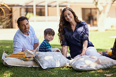 Buy stock photo Parents, boy and picnic at park with portrait, smile and relax on lawn with books, care and bonding in summer. Mother, father and son with love, connection and outdoor on blanket with family in Italy