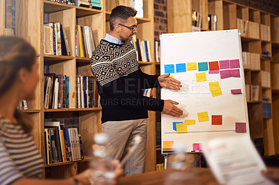 Buy stock photo Cropped shot of a businessman giving a presentation in the boardroom