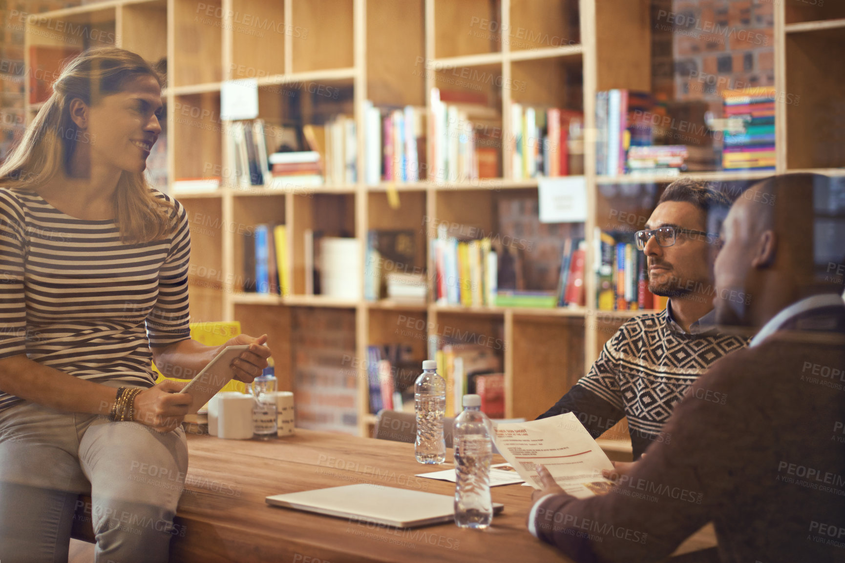 Buy stock photo Cropped shot of a group of businesspeople meeting in the boardroom