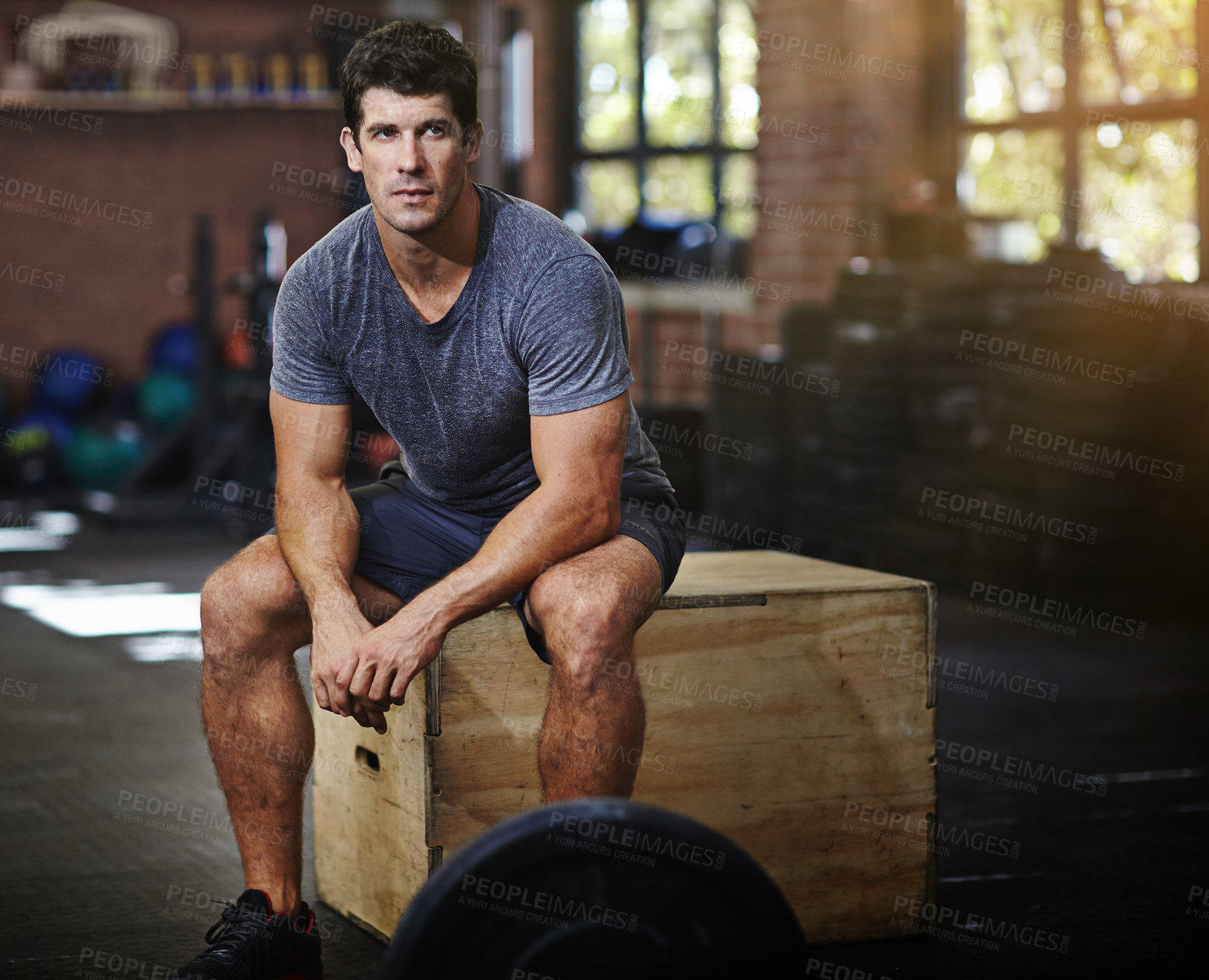 Buy stock photo Portrait of a young man taking a break from working out in a gym