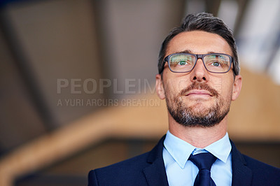 Buy stock photo Shot of a confident businessman in an office