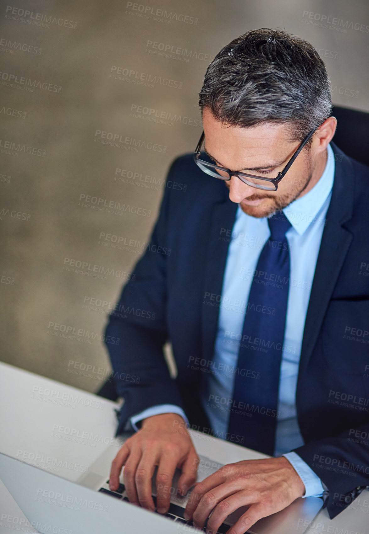 Buy stock photo Office, laptop and businessman typing at desk with research, legal advice and networking at law firm. Lawyer, attorney or mature man with computer, email and consulting with online feedback above