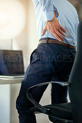 Buy stock photo Shot of a businessman suffering from back pain