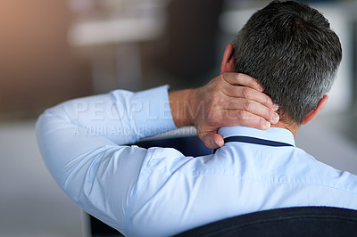 Buy stock photo Shot of a businessman suffering from neck pain