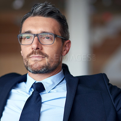 Buy stock photo Shot of a confident businessman in an office lobby