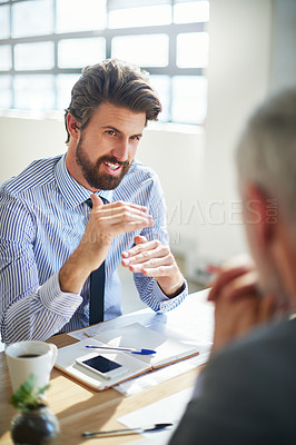 Buy stock photo Cropped shot of two businessmen talking in the office