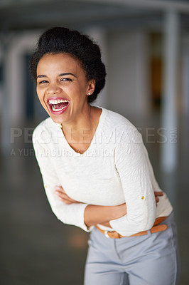 Buy stock photo Cropped portrait of a young businesswoman laughing in the office