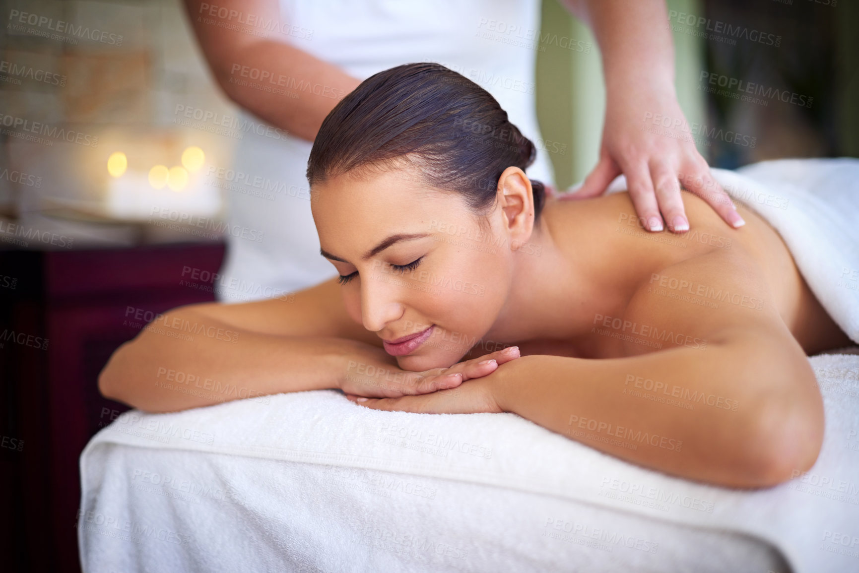 Buy stock photo Peace, woman and back massage with therapist at spa for relax, wellness and pain relief at luxury resort. Hands, masseuse and person in beauty therapy at salon for body treatment, detox and health