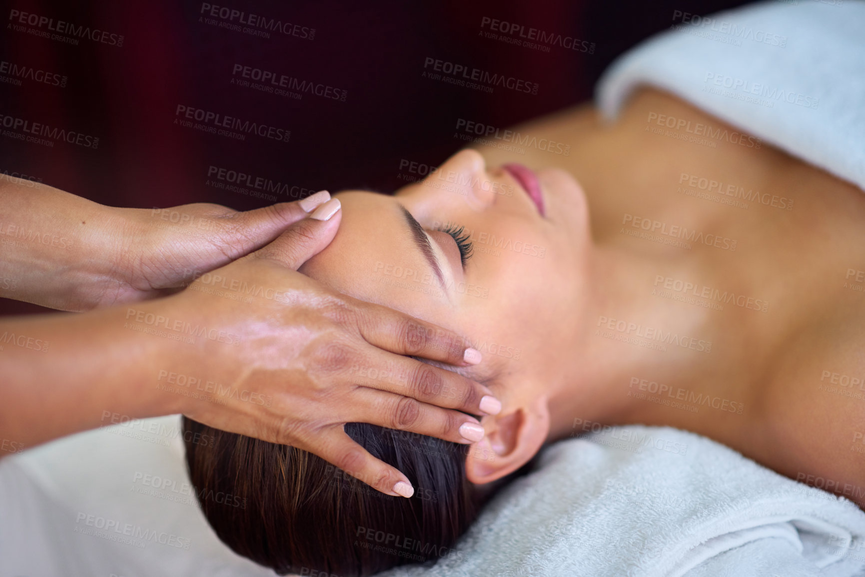 Buy stock photo Shot of a young woman receiving a head massage at a spa