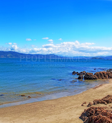 Buy stock photo Ocean, horizon and shoreline with rocks, blue sky or sand for vacation and environment to relax. Brazil, landscape and view of island, sea and beach in Rio de Janeiro with destination for travel 