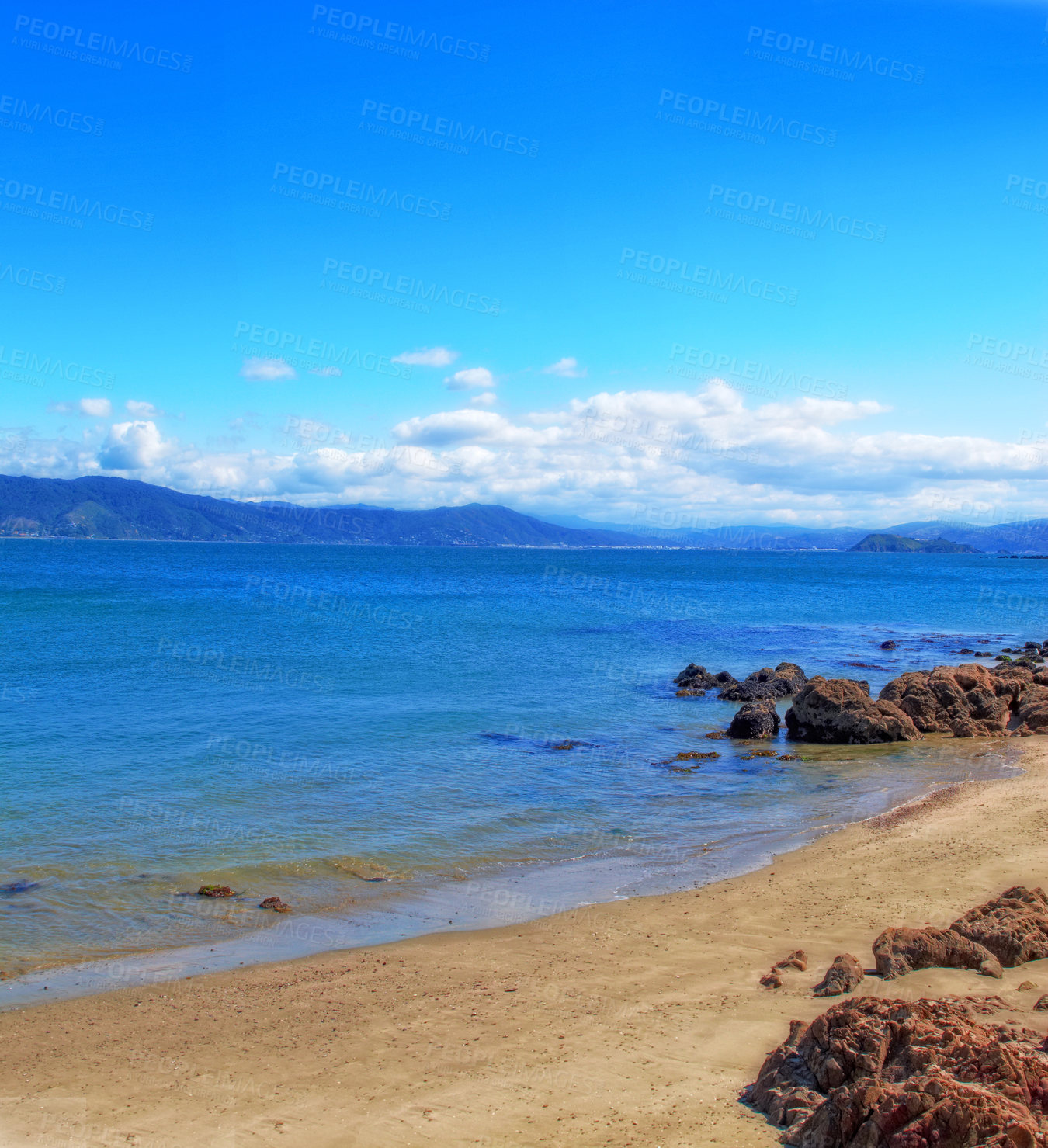 Buy stock photo Ocean, horizon and shoreline with rocks, blue sky or sand for vacation and environment to relax. Brazil, landscape and view of island, sea and beach in Rio de Janeiro with destination for travel 