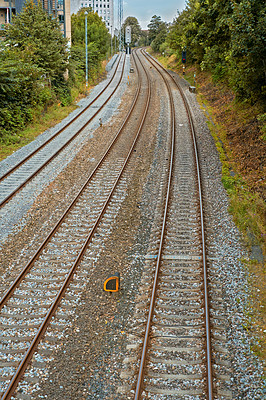 Buy stock photo View of three old railway tracks leading out of a city in Denmark. Travel and commute by public train to work. Abandoned steels rails for freight trains, transportation, import and export industry