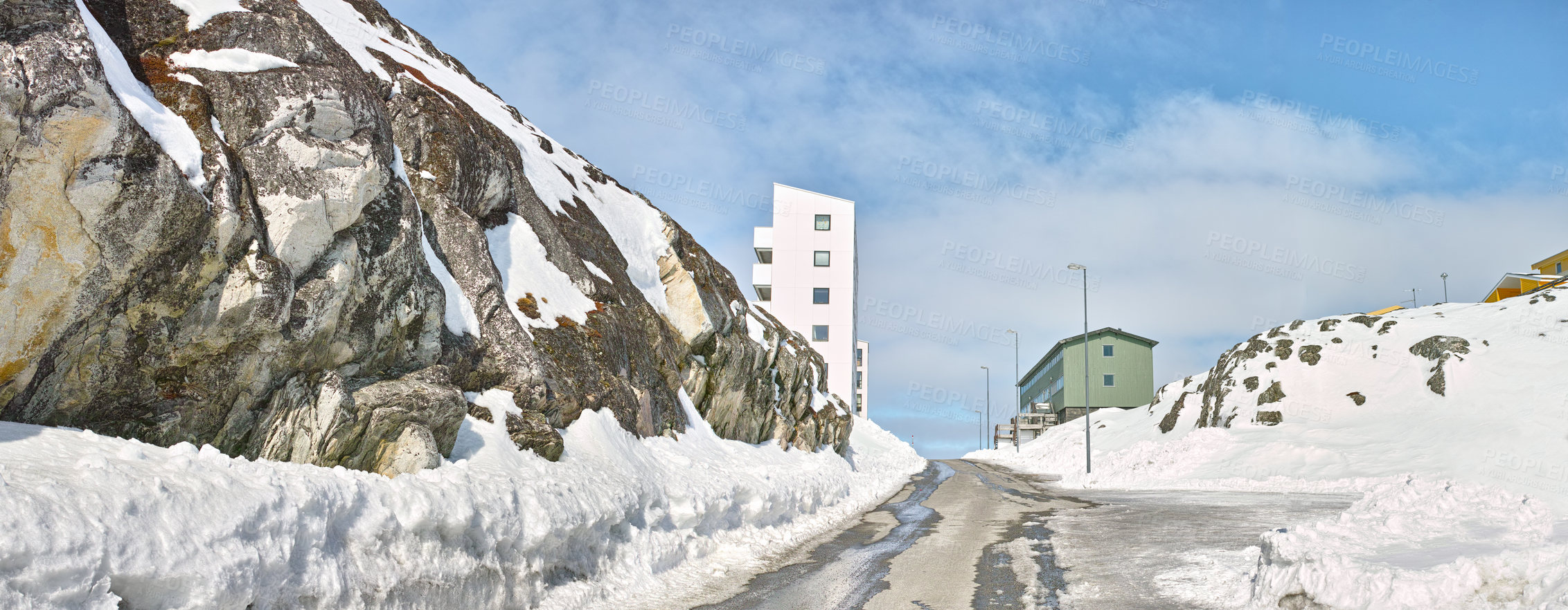 Buy stock photo A snowy mountain road or street in a small town or city on a winter day. Empty urban location on a cold afternoon with ice on the pathway or roadway. White snow outdoors in a suburb in Europe