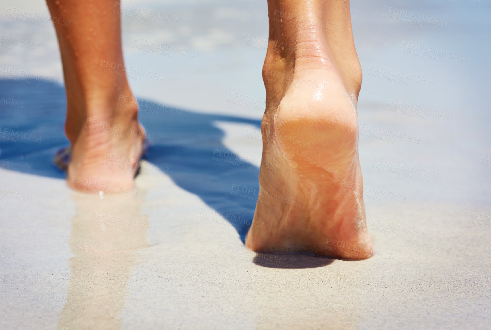 Buy stock photo Feet, person and walking at beach, sand and water for vacation, adventure and outdoor in summer. Footprint, sole and ocean with steps in sunshine on holiday, nature and tropical seaside in Thailand