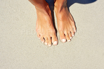 Buy stock photo Cropped shot of a woman's feet at the beach