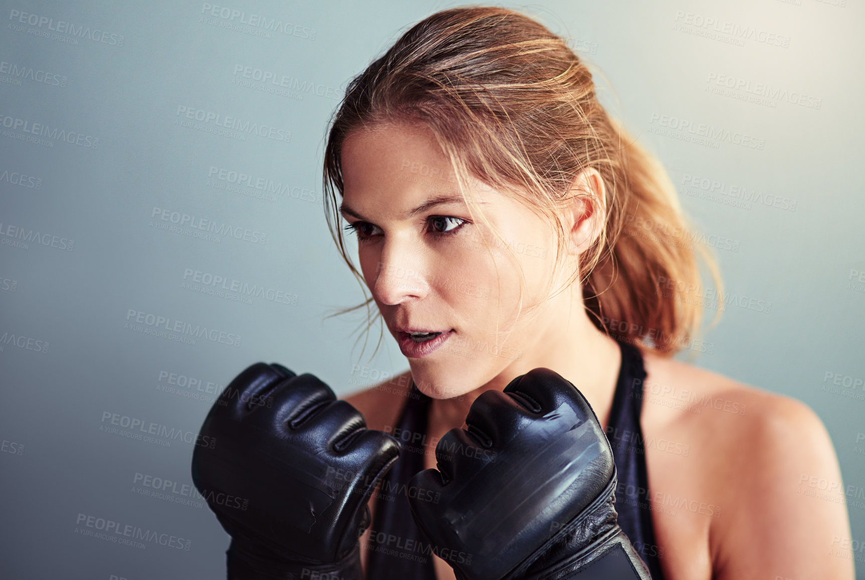 Buy stock photo Boxing gloves, fitness and woman in studio for workout, fighting or cardio training for strength. Sports, boxer and female athlete with equipment for exercise or punching isolated by gray background.