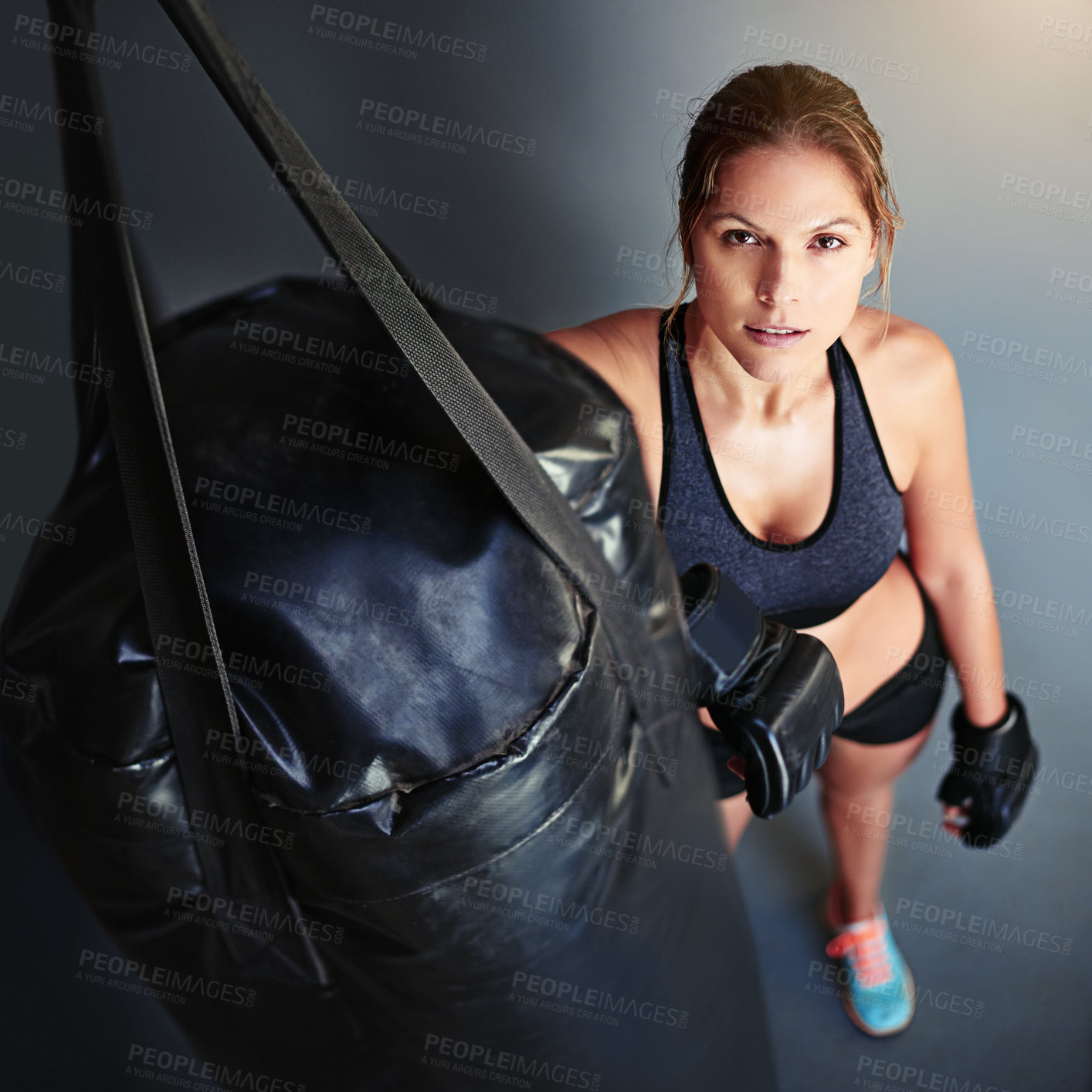 Buy stock photo Woman, punching bag and portrait in gym for training, mma and above for competition, sports and fitness. Person, gear and ready for martial arts, workout and exercise for combat, fight or contest