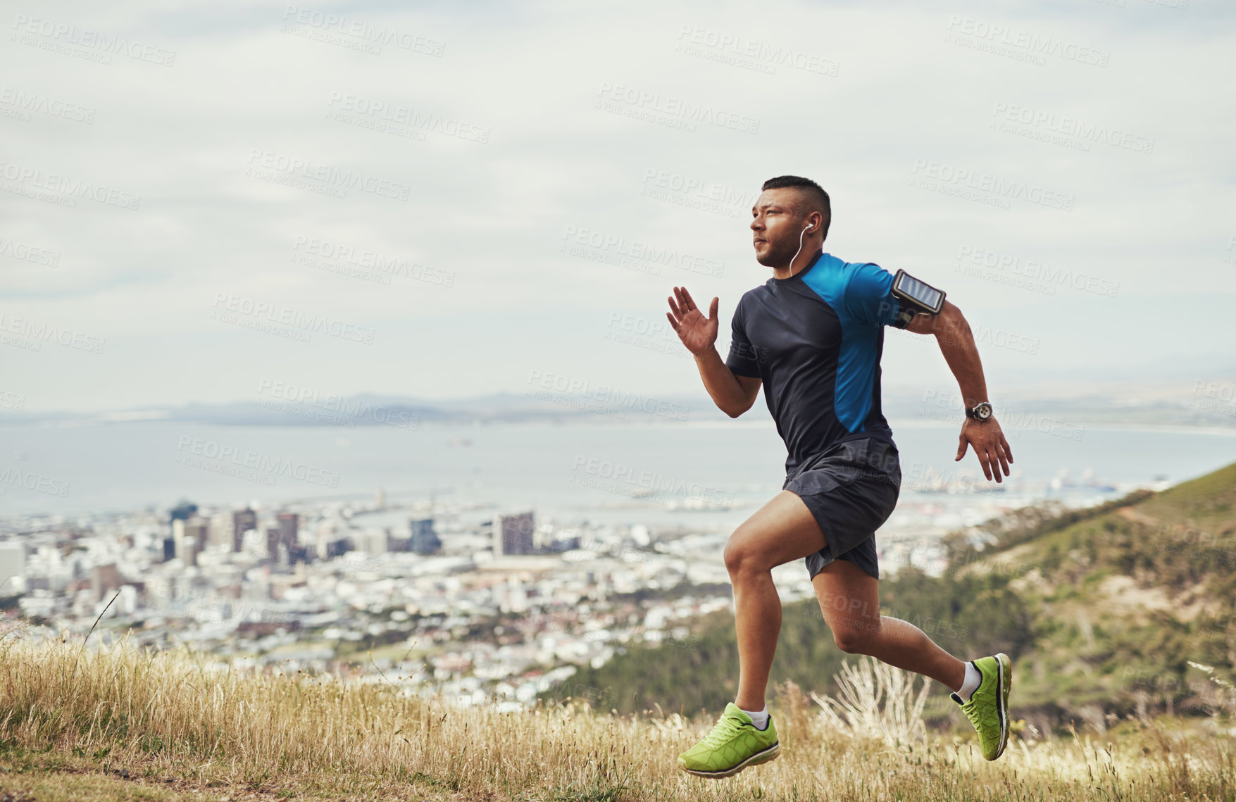 Buy stock photo Full length shot of a young man running outdoors