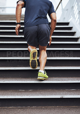 Buy stock photo Cropped shot of a sporty young man running up steps