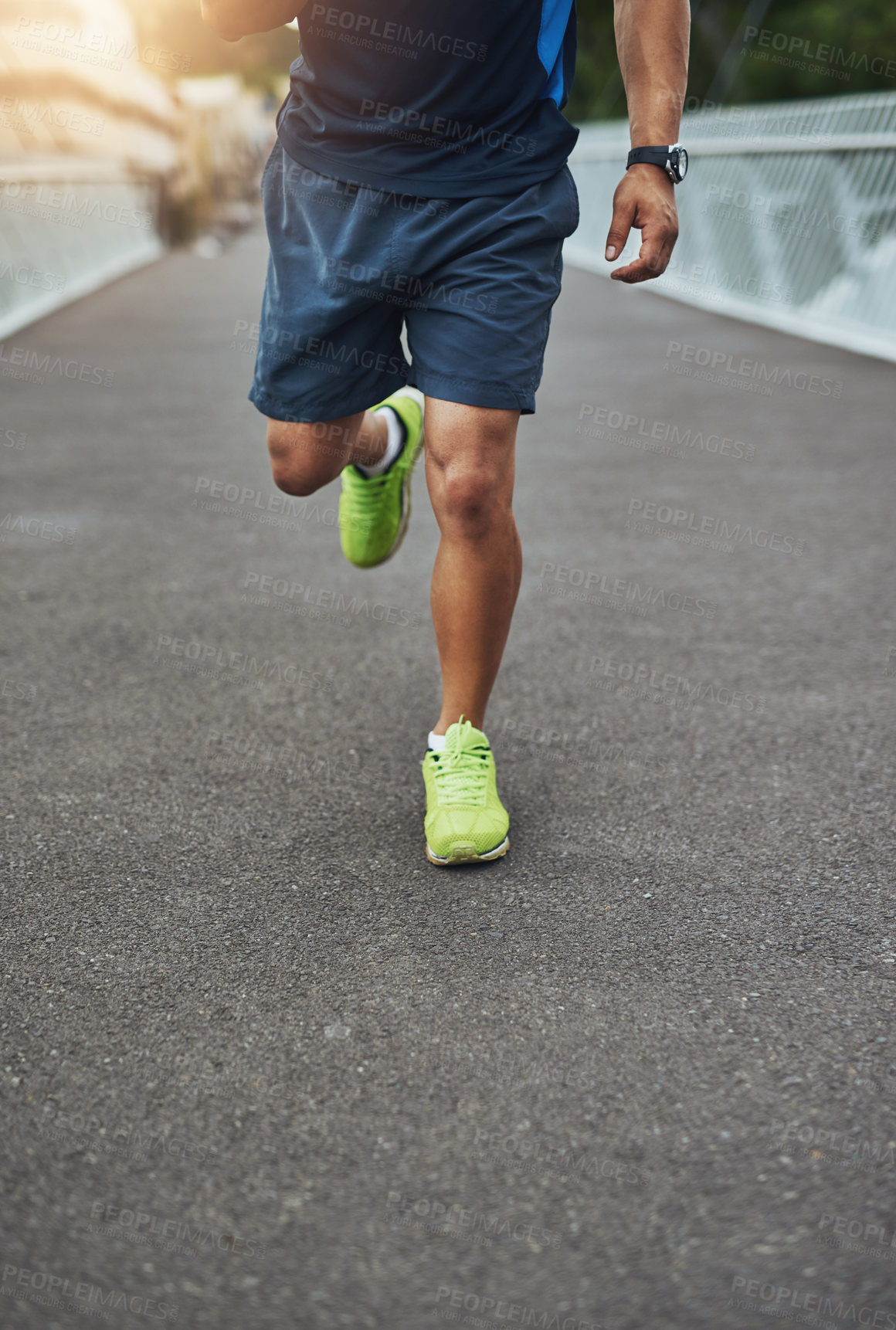 Buy stock photo Running, fitness and legs of man in city for exercise, marathon training and active lifestyle in urban town. Sports, health and feet of person on road for cardio, workout and wellness outdoors