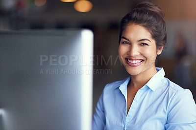 Buy stock photo Portrait of a young businesswoman sitting at her office computer