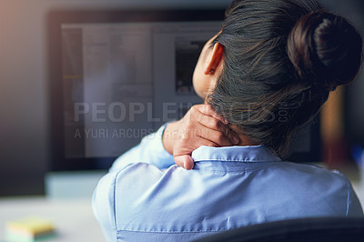 Buy stock photo Rearview shot of a businesswoman suffering from neck pain at the office