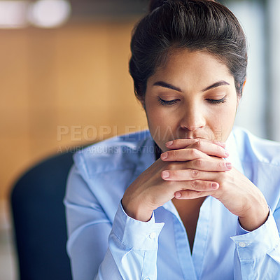 Buy stock photo Cropped shot of a young businesswoman looking stressed at the office