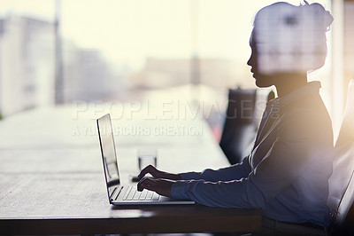 Buy stock photo Cropped shot of a businesswoman working on her laptop in the office