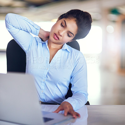 Buy stock photo Shot of a young businesswoman suffering from neck pain while sitting at her desk