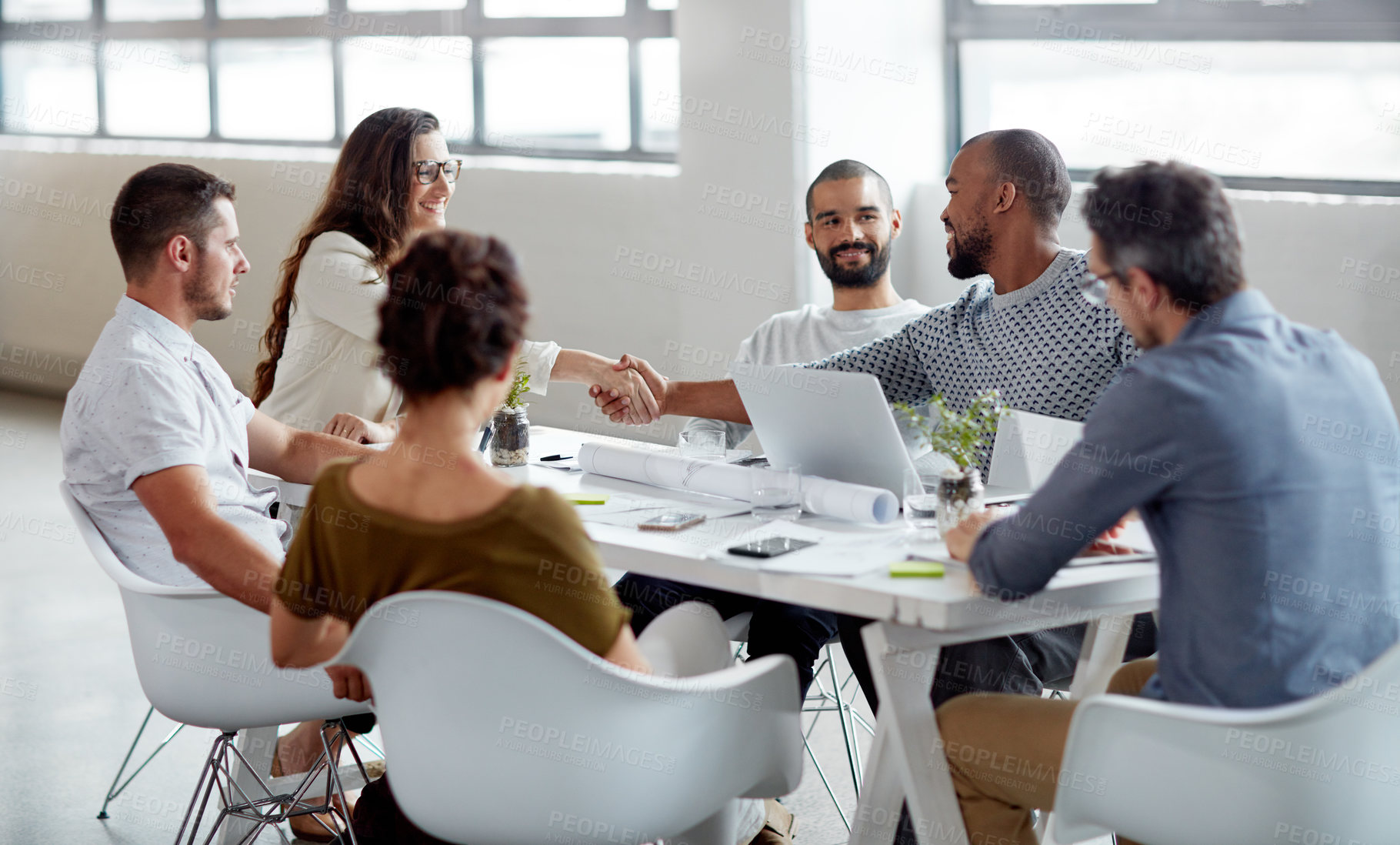 Buy stock photo Shot of a group of businesspeople meeting in the boardroom