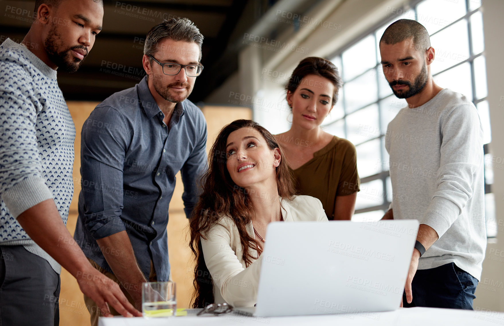 Buy stock photo Shot of a group of businesspeople meeting in the boardroom