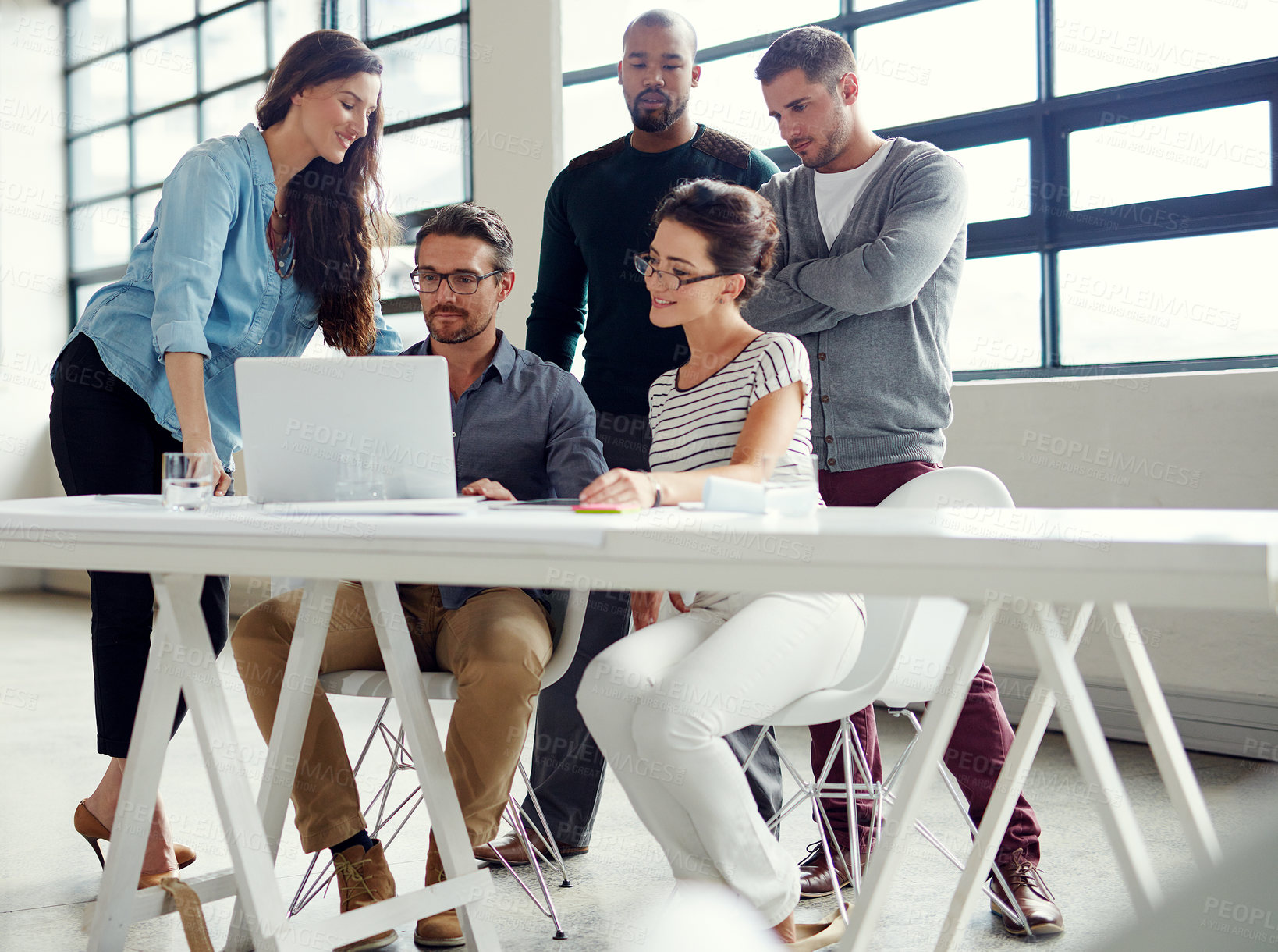 Buy stock photo Shot of a group of coworkers having a meeting in an open plan office