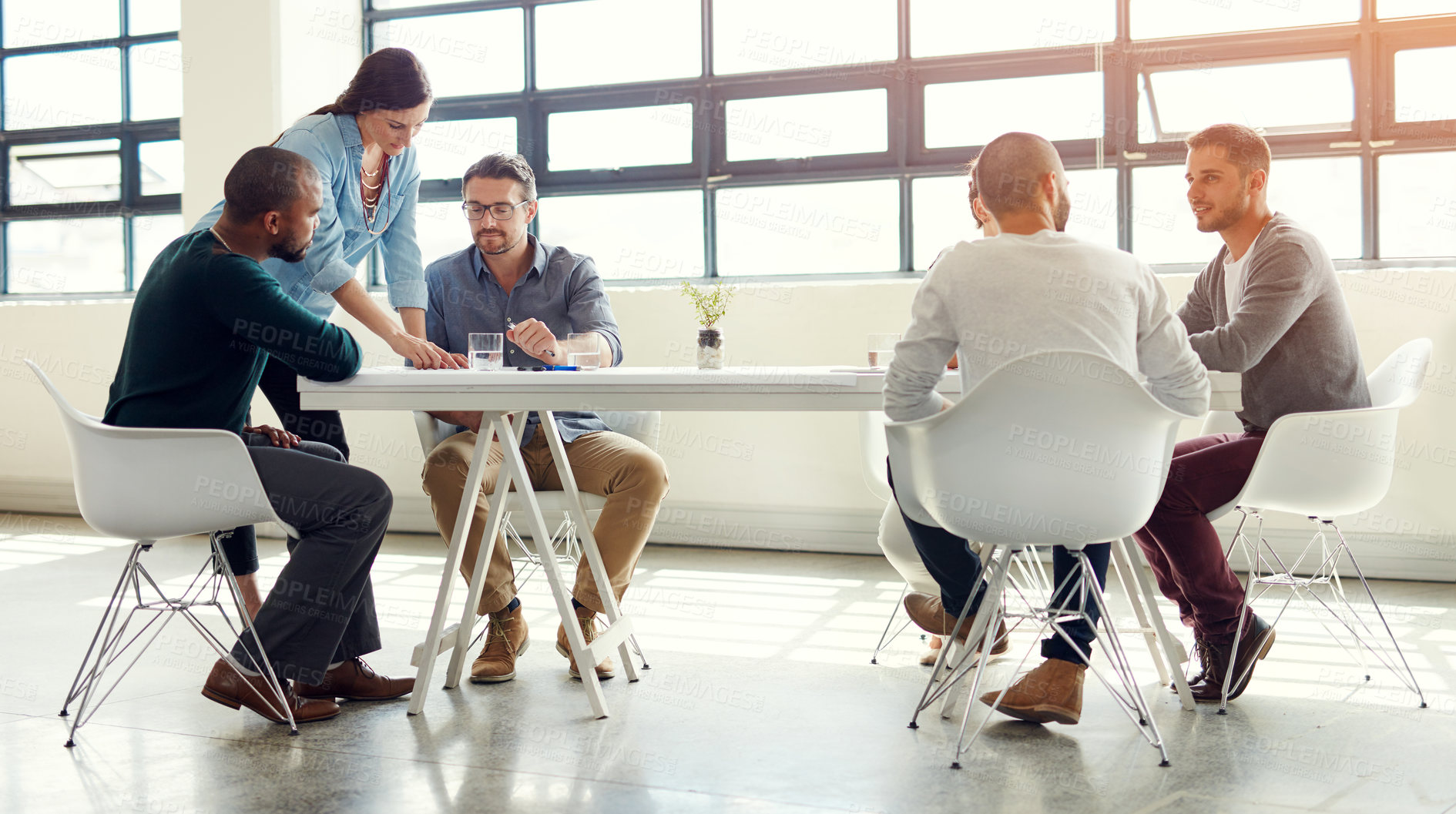 Buy stock photo Group, woman and reading in meeting, boardroom and news anchor with producers, discussion or explaining. Talking, people and solution for low ratings, viewership and journalist in office or ambitious