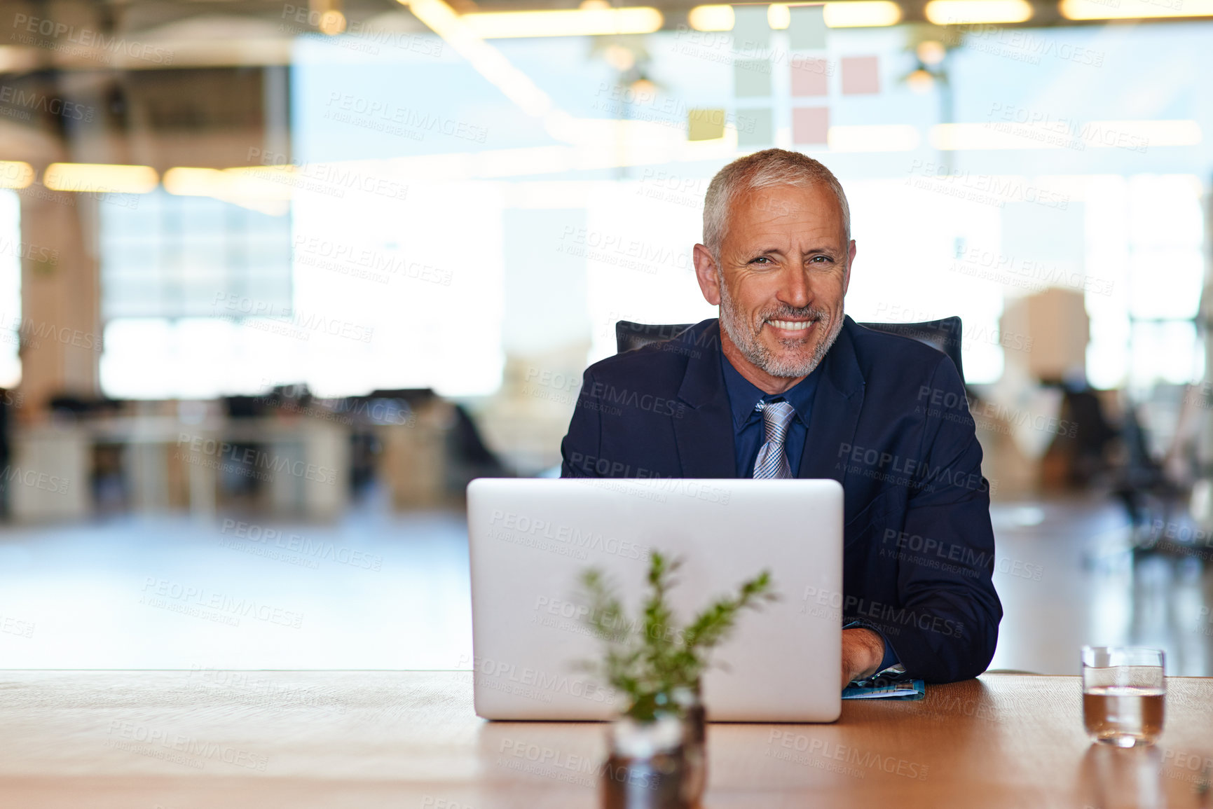 Buy stock photo Laptop, portrait and smile of mature manager at desk in office for administration or research. Computer, management and planning with happy man in corporate workplace for professional career